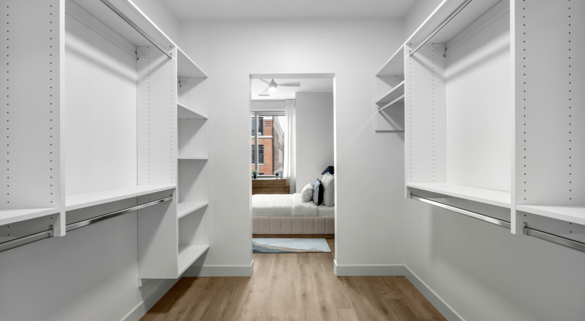 Spacious walk-in closets with built-in shelving and storage